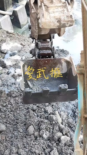 Excavator in Action: Close-Up of Soil Digging