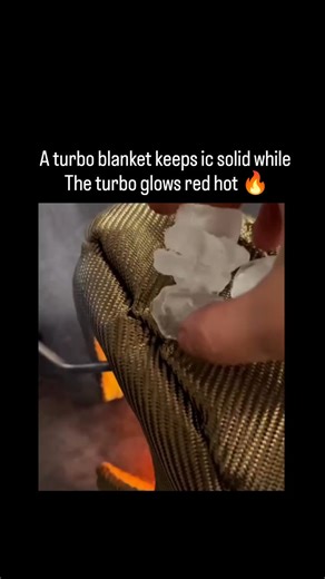 Lucky Clips on Instagram: "This viral video is a dramatic demonstration of a Turbo Blanket's thermal insulation properties. In the automotive world, these blankets are essential for keeping heat inside the turbine (the "hot side") and away from sensitive engine components. Detailed Description of the Reel * The Setup: The video features a high-performance turbocharger covered by a textured, gold-colored heat-shielding blanket (often made of materials like pulverized lava rock or carbon fiber). *