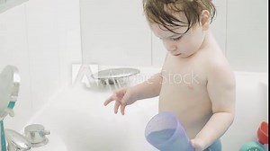 Boy child bathes in bath
