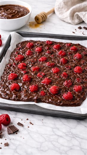 Soul Food Kitchen by Dianne on Instagram: "Chocolate PB Raspberry Bark aka the freezer snack you’ll make on repeat ❄️✨ If you want something sweet, chocolatey and satisfying without the chaos — this is it. Minimal ingredients. Zero baking. Big snack energy. This uses peanut butter powder which reduces your fat load whilst giving texture protein and flavour- win win. Recipe 👇 • 2 tbsp PB2 powder • 1 tsp cocoa powder • 1 tbsp honey (adjust to taste). I use @forestfreshhoney • Water, added slowly 