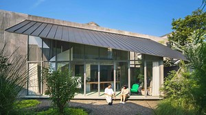 In this week's episode, we explore a unique home that stands out with its distinct trapezoidal shape, occupying a generous 200 square metres. The design reflects a blend of traditional and contemporary styles, taking inspiration from mid-20th-century architecture, with an emphasis on raw materials. | Stacked Homes