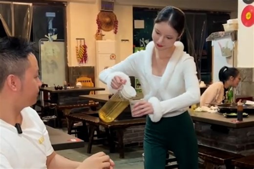 Robot waitress pours a stiff drink