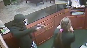 Woman robbed at gunpoint