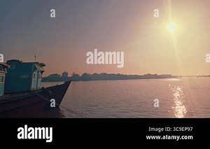 The boat is anchored and the sun rises over the Kapuas River, Pontianak Stock Video Footage - Alamy