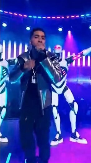 Futuristic Rap Show: Human Rapper & Robot Dancers Dominate the Stage