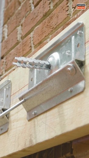 Looking for a hassle-free solution for attaching a deck to a brick home? Check out our BVLZ brick veneer ledger connector. This connector allows for easy and secure attachment of your deck's wood ledger to the framing through the veneer, without having to remove or replace large sections of brick veneer. https://bit.ly/3MPwV9o | Simpson Strong-Tie