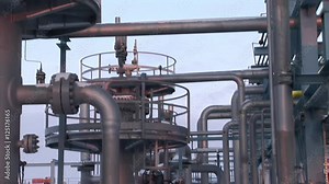 Underground storage of natural gas. Factory distribution, and industrial processing of natural gas with Worker. Many pipelines and construction.