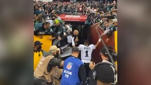 See moment fans fall from railing at Eagles game