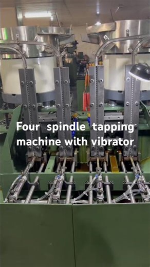 Nut tapping machine with vibrator
