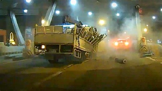 Truck loaded with gas cylinders crashes into Thai toll booth in drunk driving incident