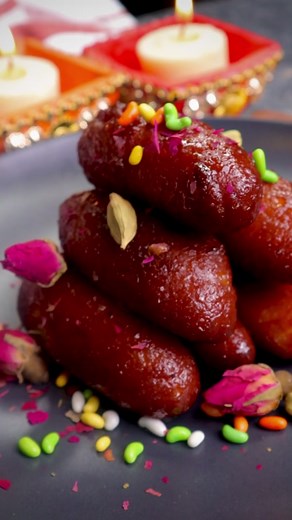 Here is a Fijian Gulab Jamun recipe! This is a classic Indian sweet made with condensed milk and spices, then shaped into a cylinder shape and fried. It’s dipped in a delicious rose water syrup! There are many places around the world that enjoy cylinder-shaped Gulab Jamun like Trinidad (Caribbean), and Mauritius (Africa) just to name a few. Since many places around the world are celebrating Diwali, I thought it would be perfect to share! #indiandesserts #Fiji #diwali #sweets