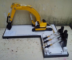 EXCAVATOR WITH SYRINGE HYDRAULICS