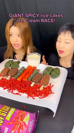 Kim&Liz on Instagram: "Giant spicy rice cakes race! #food #eating #mukbang #ricecake #chocolate #icecream"