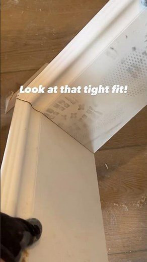 Cutting baseboards using a coping saw. #home #diy #howto #carpentry #shorts