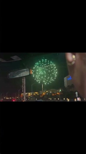 Baby Ariel watches fireworks from the car