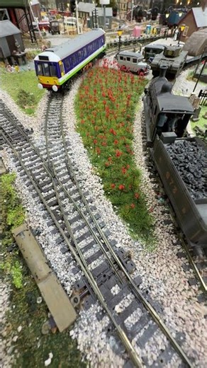 British Rail Class 121 "Bubble Car" number 121027 passes the Poppy field.