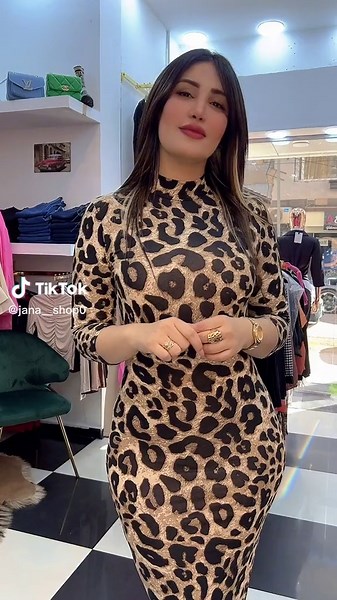 Stylish Leopard Print Dress Try-On in Clothing Store