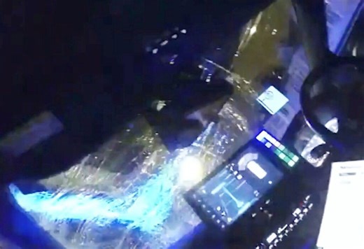 Terrifying moment 'stolen' Land Rover reverses over police car