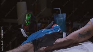 Tattoo master make tattoo on the arm. Tattoo machine close up. Artist tattooing at the workshop. Concept: tattooist, tattooer, freedom, art, young, 4k resolution