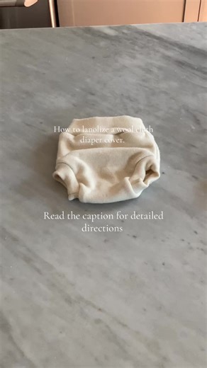 Wool covers need to be lanolized before you use them to become waterproof. We recommend Lanolin Oil for best results (some people claim that you can use Lansinoh, but we have never had much success with getting it to distribute evenly across the cover). To lanolize your wool items: Begin with dry, clean wool. If lanolizing items with snaps, be sure to unsnap. Draw a pan/bucket/sink of lukewarm water (hot water will felt and shrink wool). Take a separate cup of very hot water and add a pea size d