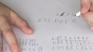 child, schoolchild hesitantly solve difficult task of adding numbers, writes down numbers, makes mistakes in notebook with pen, math lessons, education concept, elementary school