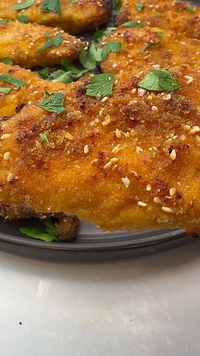 OVEN-BAKED CRISPY SCHNITZEL! I know that fried schnitzels are the best, but these oven-baked schnitzels, are going to surprise you! 🤩 Recipe: Ingredients- 2 pounds of of thin chicken cutlets 2 eggs 1 teaspoon of sea salt 1/4 teaspoon of black pepper 1 teaspoon of paprika 1 teaspoon of cumin 1 tablespoons of Dijon mustard 1 tablespoon of honey Juice from 1/2 lemon 2 minced garlic cloves 2 tablespoons of olive oil For the breadcrumbs mix- 1/2 cup of panko bread crumbs 1 cup of breadcrumbs 1/4 cup