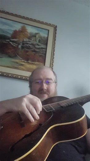 Mike T. Kerr on Instagram: "Lo-fi phone, messy hair, grooving. Back to fingerpicking in 2026, Ragtime, Country Blues, dance music. Music was once, as they say, for dancing. #fingerpickingblues #countryblues #guitar"