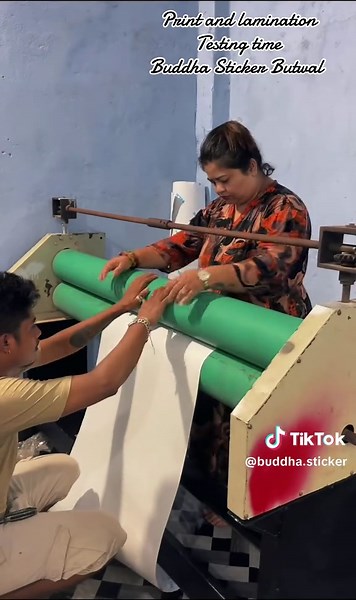 Laminating Buddha Stickers in Butwal