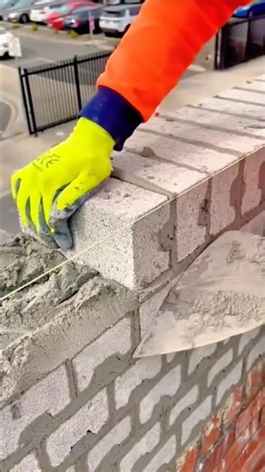 Aligning Concrete Blocks with a String Line for a Strong Clean Wall Finish