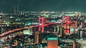 Night Time lapse of Kitakyushu City with Wakato Bridge from Takatoyama Observatory. Fukuoka Japan. Landmark in Business downtown in Kitakyushu Fukuoka Japan. Public transport Business District