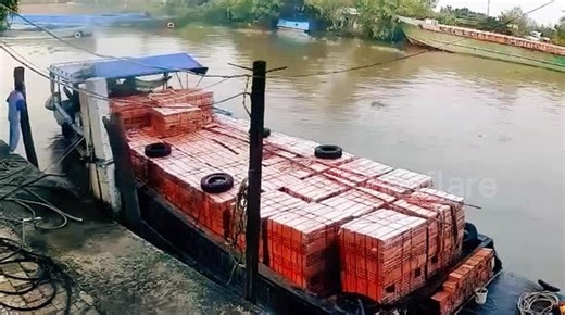 Barge carrying bricks capsizes with fast-footed worker scurrying to safety