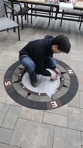 Installing the Iron Point Compass rose in a patio. It points north. #asmr #satisfying #assemble