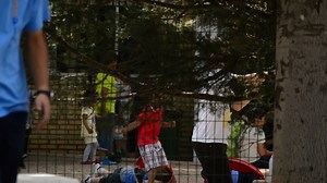 Download Children playing in a schoolyard during recess