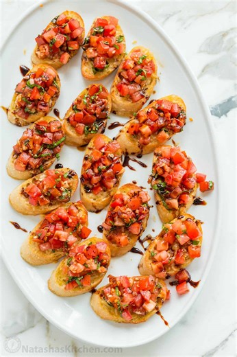 This was voted the BEST Bruschetta Recipe: https://natashaskitchen.com/classic-bruschetta-recipe/ | NatashasKitchen.com