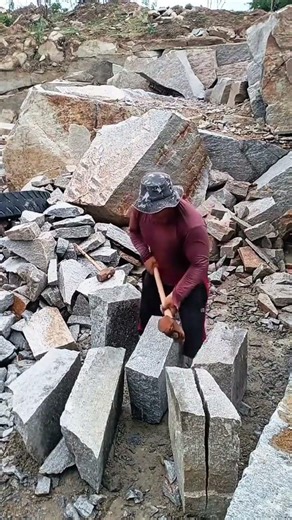 The Fascinating Process of Manually Splitting Rocks in a Quarry
