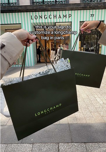 when you buy a new longchamp bag in paris they’ll stamp it with the eiffel tower 🥹 the cutest souvenir 🇫🇷✨ #longchamp #parisshopping #longchamplepliage