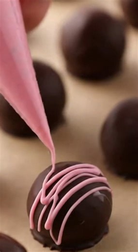 With Valentine’s Day around the corner, these chocolate raspberry truffles feel especially fitting. The rich dark chocolate shell gives way to a smooth, tangy raspberry center that’s romantic, indulgent, and perfect for a small homemade treat made with love. Yield: 12 truffles Ingredients Raspberry Ganache 1⅓ cups frozen raspberries, thawed ¼ cup powdered sugar ¼ cup heavy whipping cream 7 oz good-quality white chocolate, finely chopped 1 tablespoon water (only if needed) Dipping 7 oz dark choco