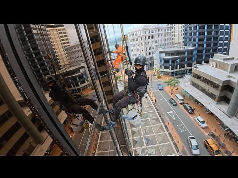 High-rise window and facade cleaning rope access #abseil #technicians #newzealand