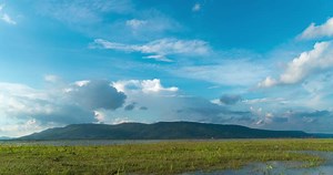 Download Time lapse of mountain on reservoir for free