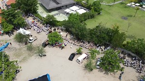 Aerial view, procession on Samuh beach during the Melasti ceremony before the silent day of Nyepi. Holidays, festivals, rituals, art, culture of the people of Indonesia and the island of Bali.