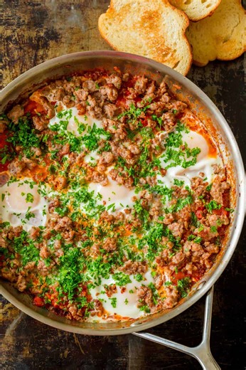This easy Shakshuka is a one-skillet meal that can be served for breakfast or dinner.😋 RECIPE: https://natashaskitchen.com/easy-shakshuka-recipe/ | NatashasKitchen.com