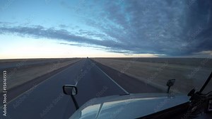 Time Lapse dashcam-style footage from the interior of a Semi Truck traveling along a rural US Highway.