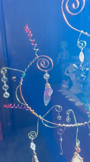 $45 Shipping is $18 but I give a gift to help with shipping costs. PM me if interested with code word: "Fairy45" A little moment of enchantment captured in copper… This handmade sculpture features a sweet fairy nestled among crystal prisms, a tiny teapot and teacup, and even a whimsical spoon and fork—like she’s paused for a bit of magic-filled tea time. A single bell brings a gentle chime, while a natural geode stone hangs below, grounding the whole piece in earthy energy. Perfect for indoors o