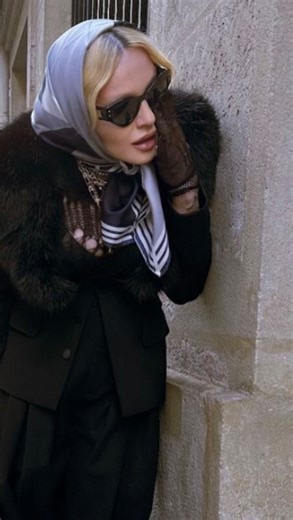 Abigail Goodman on Instagram: "It’s “As Seen In” Sunday and this is the exact Hermès scarf Madonna is wearing in Paris! She is wearing 18-3-7 by Geoff McFetridge. These numbers represent the jockeys numbers that can be seen racing on the scarf. This one was just released in a forever Twilly with leather piping and I love how geometric it looks."