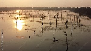 Sunset over a moat in Angkor ; drone view over a huge moat near Preah Khan temple, Siem Reap, Cambodia