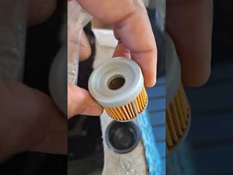 Replacing the fuel filter on a Mercruiser 3.0 engine. 1995 Bayliner 1954 Capri