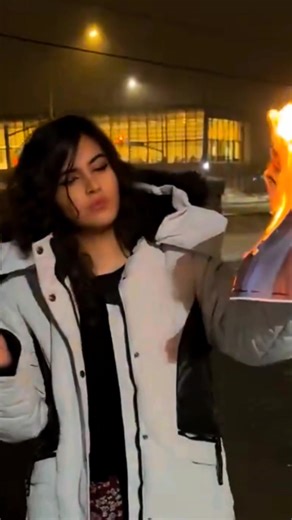 A young woman in Iran is seen burning a photo of Ayatollah Khamenei before lighting her cigarette — a powerful act of protest that is spreading online. Many young Iranian women are becoming leading voices in calls for change and freedom. #IranProtests #iraniangirl #iranianwomen #iranrevolution | Stand with Israel