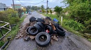 *BREAKING* Residents of Garth Road in Williamsville have dumped a load of debris and tyres in the road, as they protest poor road conditions in the area, on Monday 10 October 2022. [Video by RISHI RAGOONATH] | CNC3 Television, Trinidad and Tobago