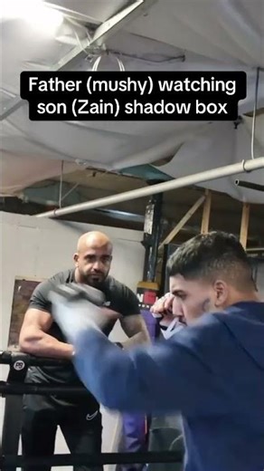 Father (mushy) watching son (Zain) shadow box