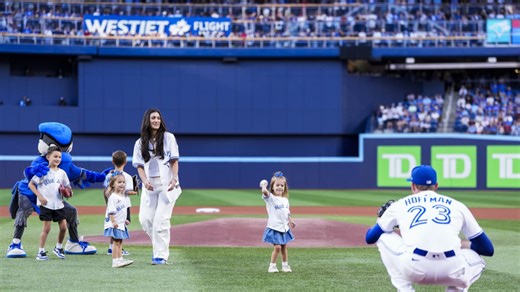 Jeff Hoffman's family throws out the first pitch
